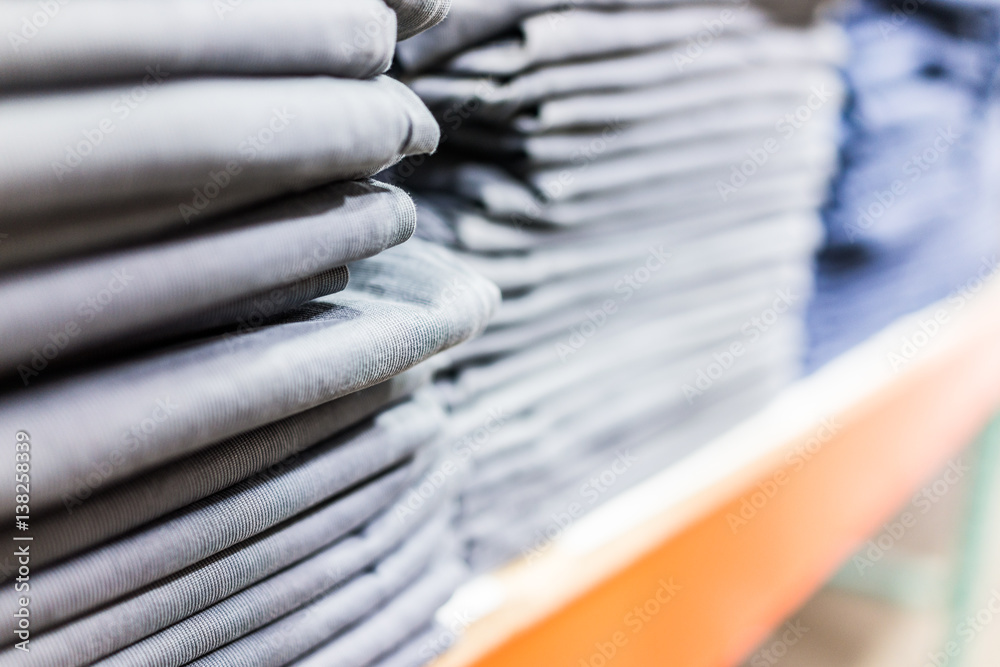 Stack of shirts or pants in store macro closeup Stack of shirts or pants in store macro closeup