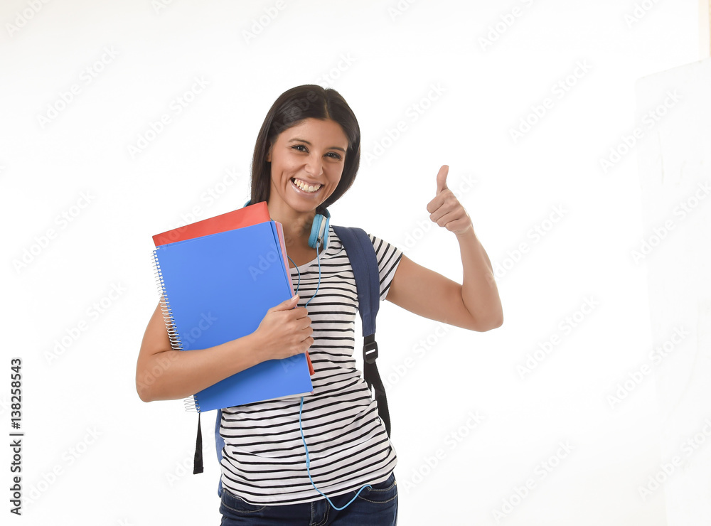 trendy latin student girl holding notepad folder and book carrying backpack smiling happy trendy latin student girl holding notepad folder and book carrying backpack smiling happy