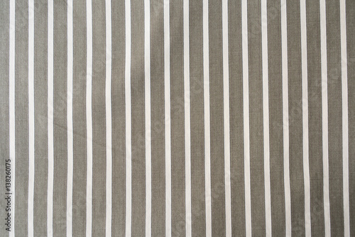 white stripes on brown cotton textile