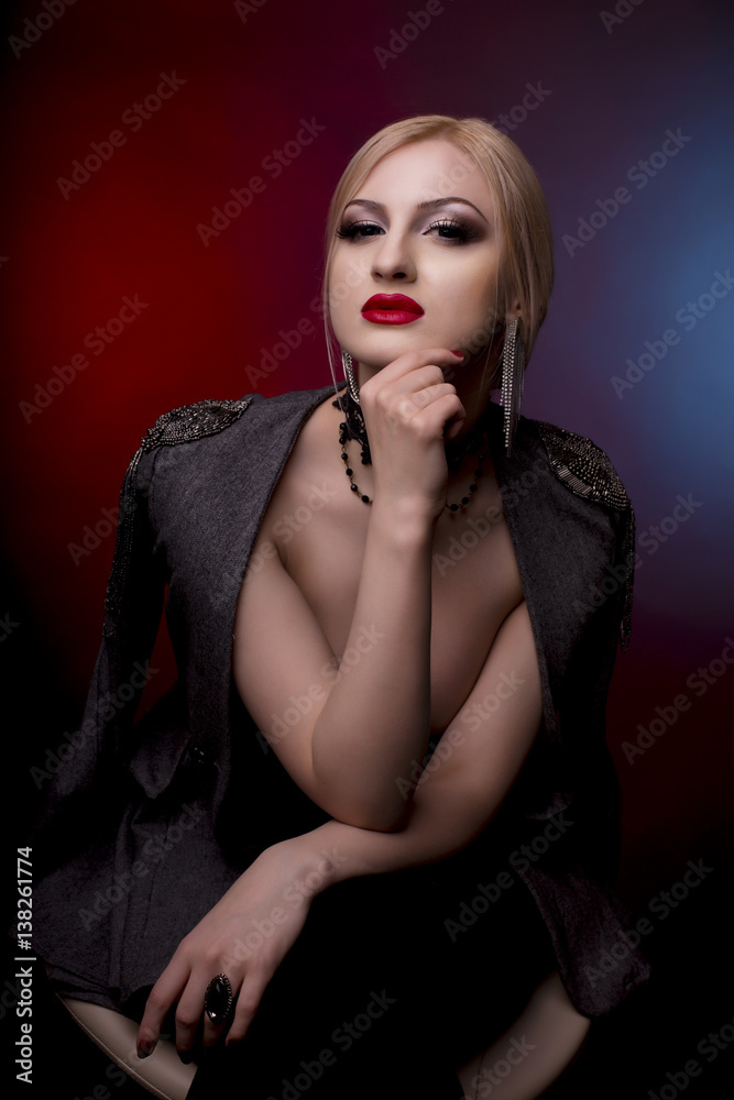 Stunning young woman with jacket on her naked shoulders Stunning young woman with jacket on her naked shoulders
