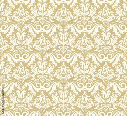 Seamless damask pattern. Traditional classic orient ornament. Golden and white pattern