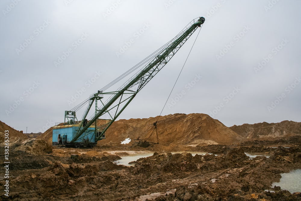 Walking excavator type dragline  in a clay quarry near the town of Pology of Zaporizhzhya region of Ukraine. Following heavy rains. March 2006