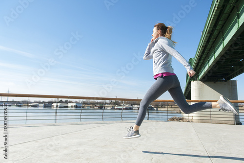 Women running on bridge