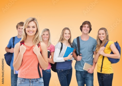 Students Smiling at camera against an orange background