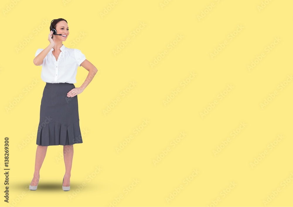 Travel agent smiling against a yellow background Travel agent smiling against a yellow background