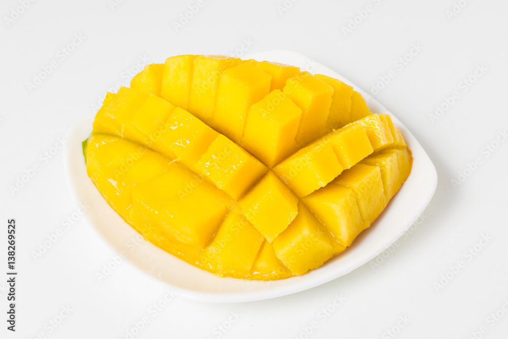 Fresh mango on the white plate Fresh mango on the white plate