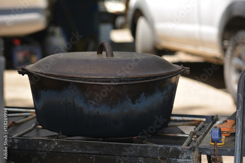 Cast Iron Dutch Oven with Lid on Cook Stove
