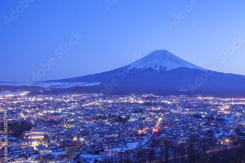 Fujiyoshida Town at night time with Mount Fuji in winter season