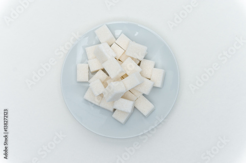 light cubes of sugar on a plate