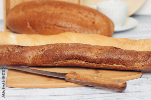 loaf and baguette on the table, knife