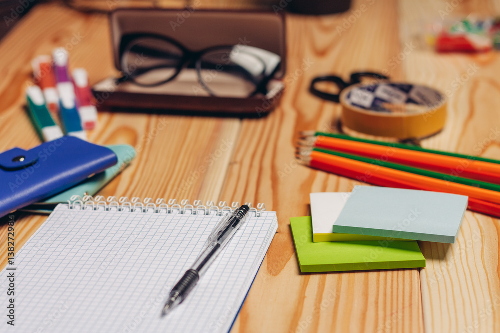 Case and glasses, notebook with pen and colored pencils Case and glasses, notebook with pen and colored pencils