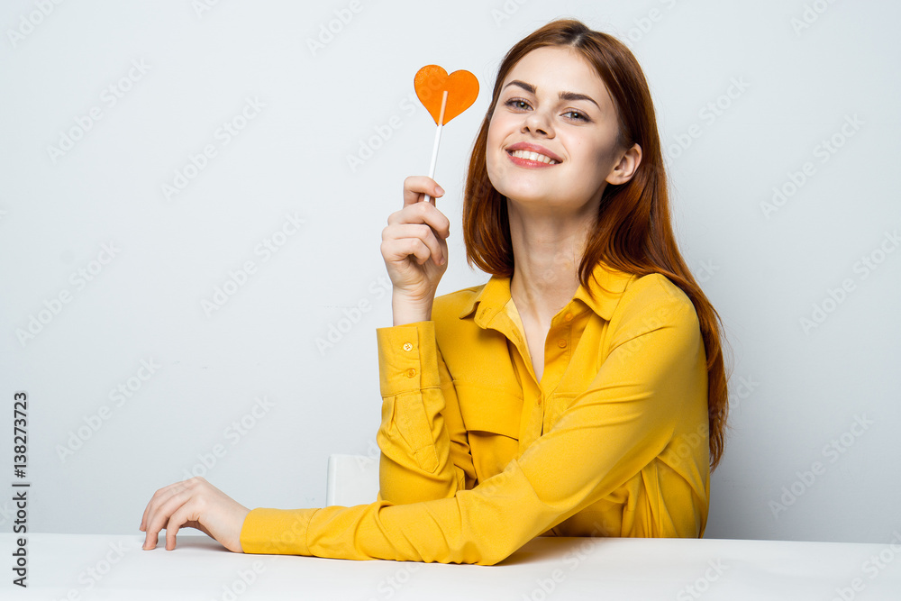 woman with lollipop, light background woman with lollipop, light background