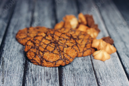 a variety of cookies on a wooden background