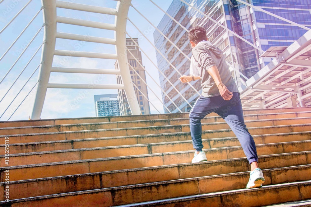 Sport man is exercising in the city