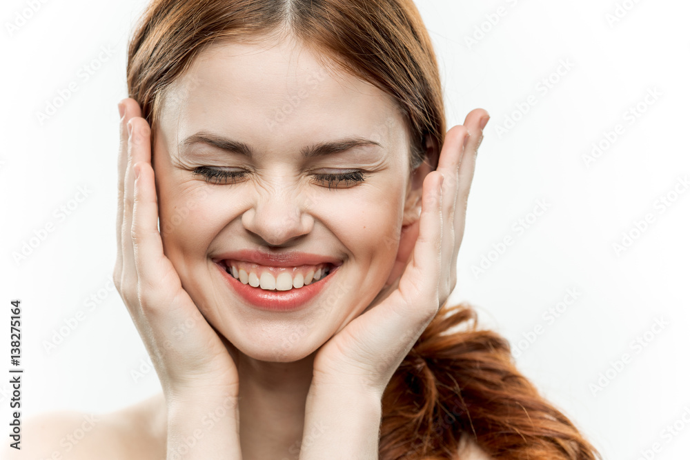 happy woman with hands near face