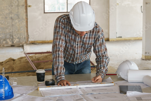 Architect and engeneer on construciton site check documents and business workflow on building