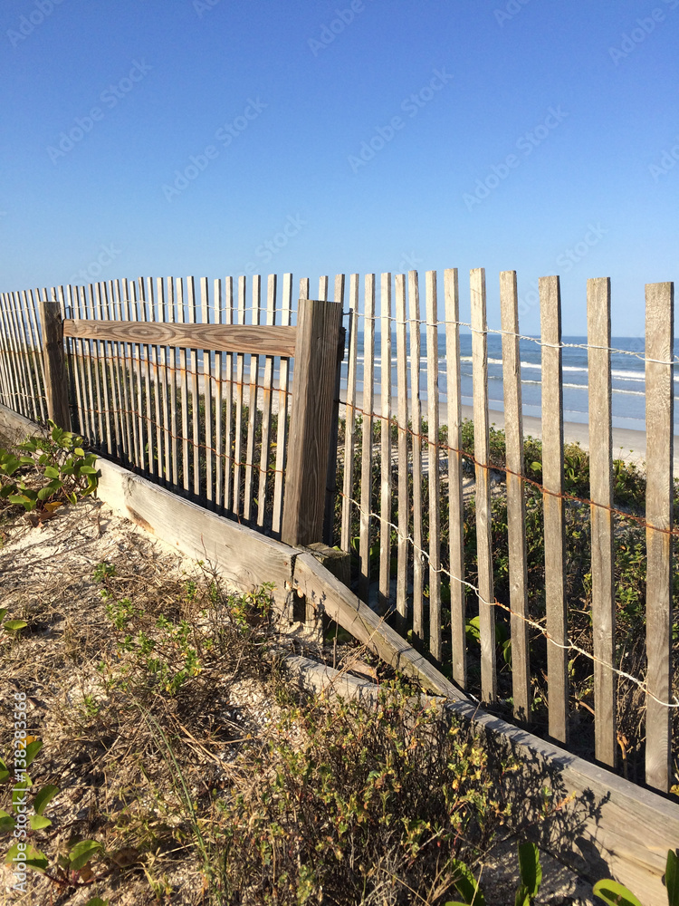 wooden fence along beach