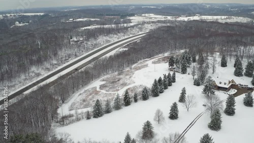 Aerial of Pennsylvania farm and highway in Winter