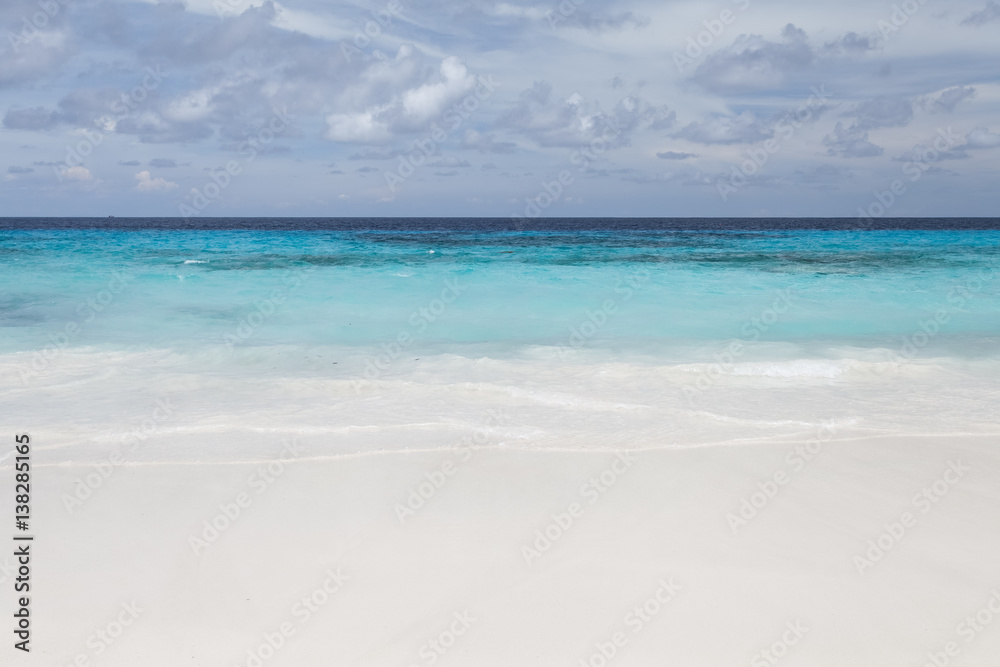 White beach sand and beautiful blue sea and sky White beach sand and beautiful blue sea and sky