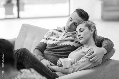 Young couple in front of fireplace