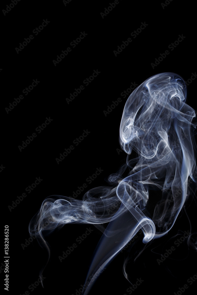 Abstract art. Color white blue smoke from the aromatic sticks on a black background. Background for Halloween. Texture fog. Design element. The concept of aromatherapy. Abstract art. Color white blue smoke from the aromatic sticks on a black background. Background for Halloween. Texture fog. Design element. The concept of aromatherapy.