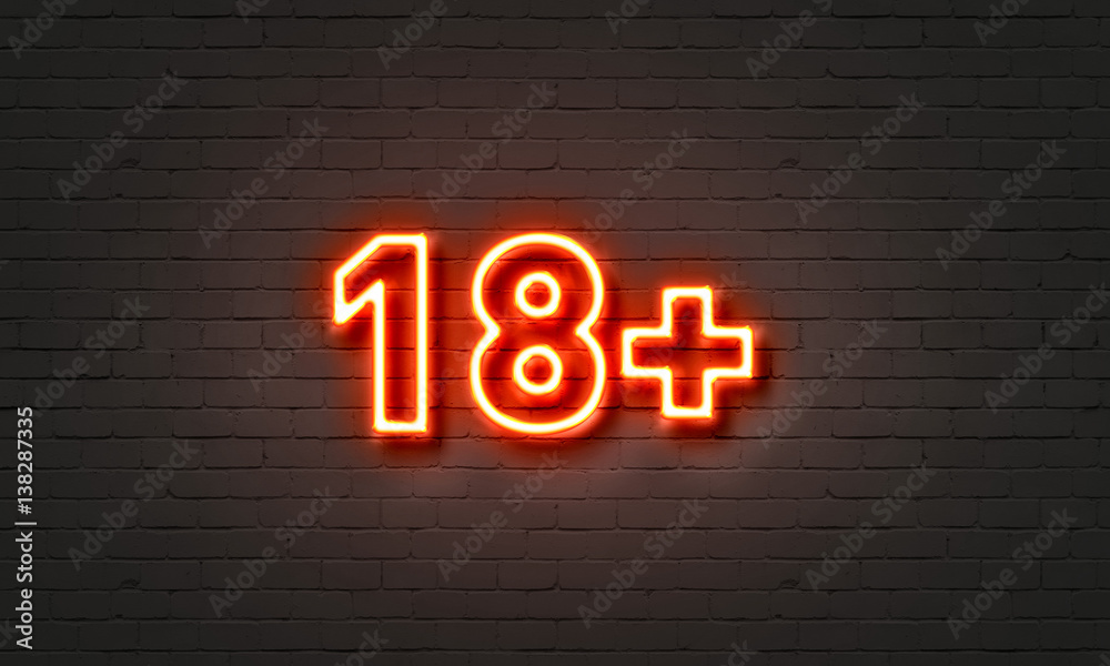 18+ neon sign on brick wall background. 18+ neon sign on brick wall background.