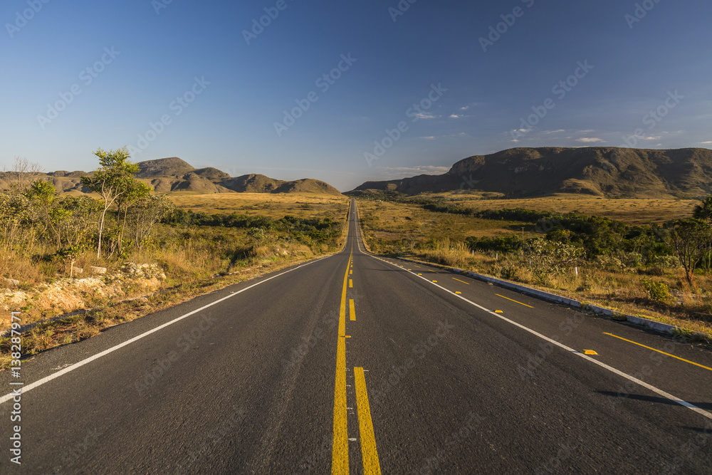 Vintage toned desert long road just before sunrise, travel concept, Brazil