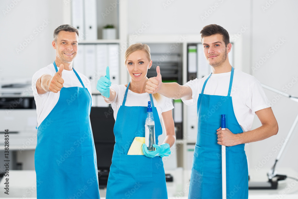 Obraz premium Portrait Of Smiling Janitors