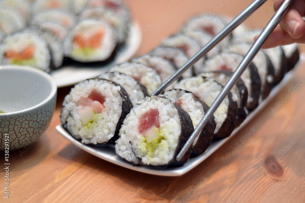 maki sushi rolls japan food on plate with foodsticks maki sushi rolls japan food on plate with foodsticks