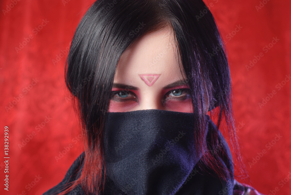 the girl with the covered face on a red background, the girl with the covered face on a red background,