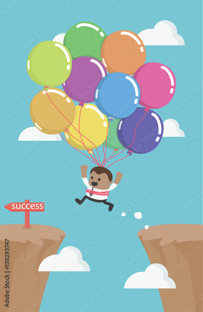   African business man flies across gap to another cliff by using balloon.