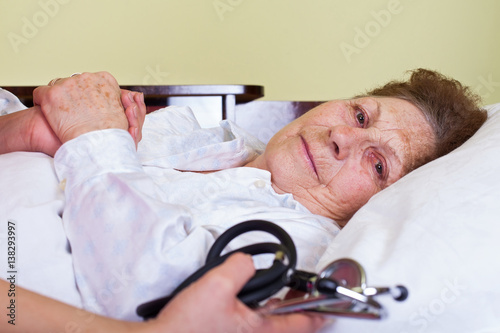 Bilde på lerret Bed ridden elderly woman