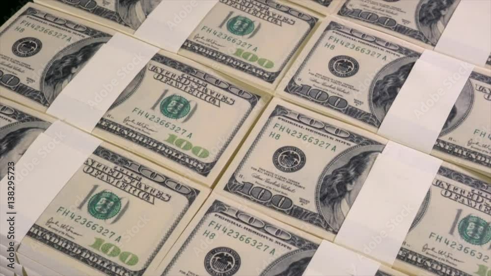 Stacks of US dollars in hundred dollar banknotes Stacks of US dollars in hundred dollar banknotes