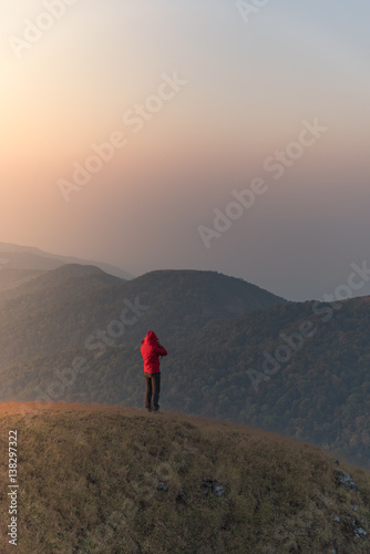 Woman on the top of mountain with sunlight in the morning © Natapol