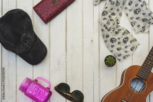 Ukulele hat wallets, sunglasses, mugs Purple Cactus small. White on the wooden floor