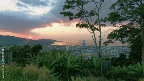 Aerial, 4K Landscape View of Patong Town In Phuket South of Thailand at sunset 