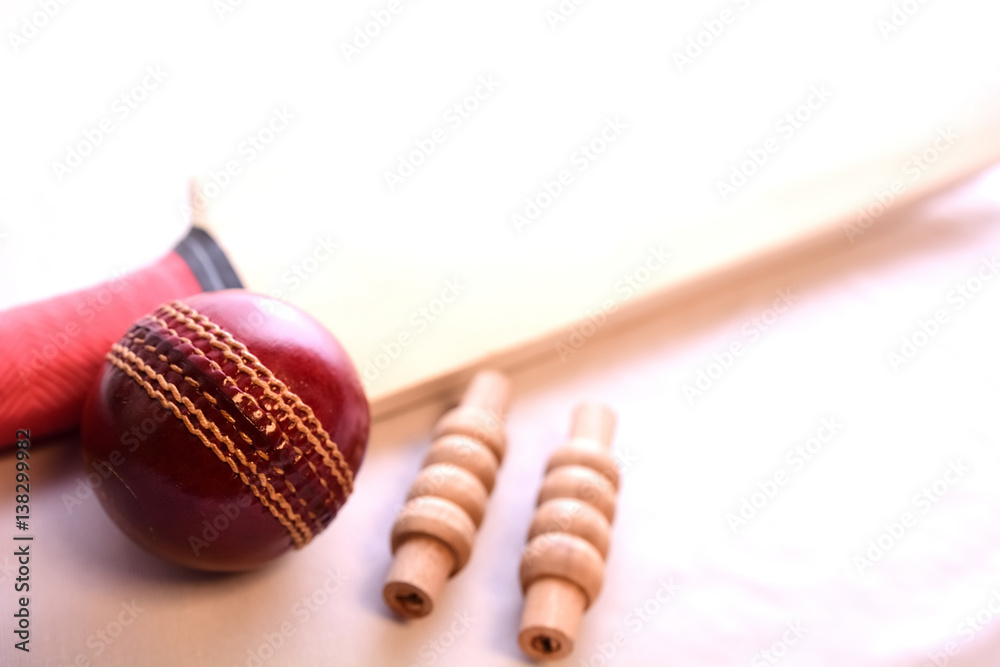 Cricket bat, ball and bails on isolated white background Stock Photo