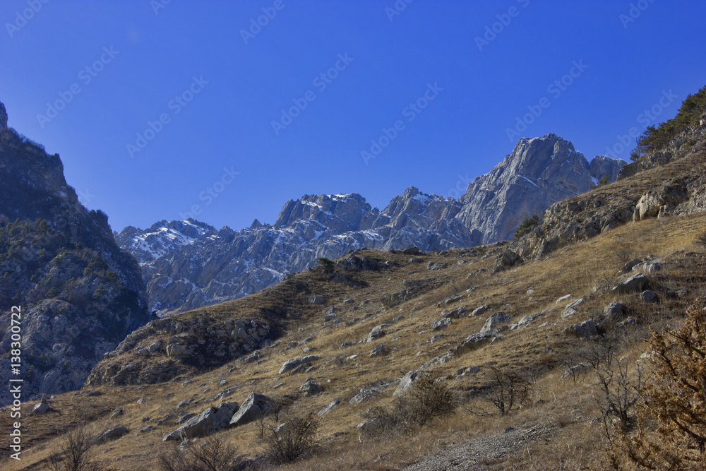high rocky mountains and blue sky