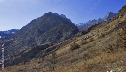 high rocky mountains and blue sky