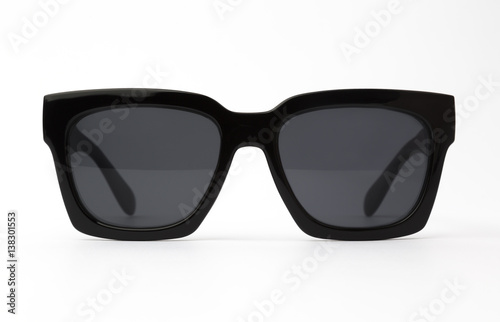 Chic sunglasses with black plastic frame isolated on white background, front view.
