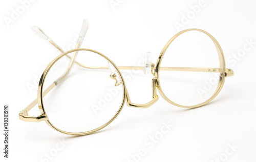 gold Eye Glasses Folded Isolated on White.