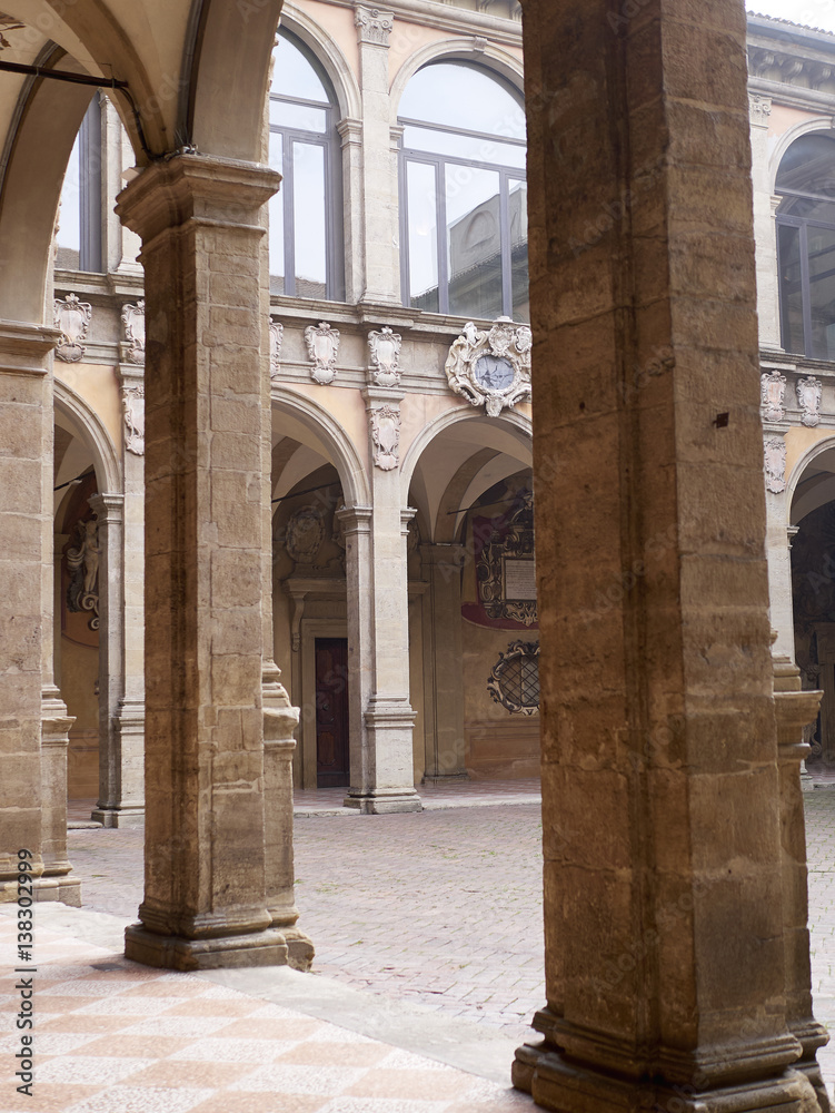 Fototapeta premium tower and courtyard of Archiginnasio palace - the first official headquarters for the University