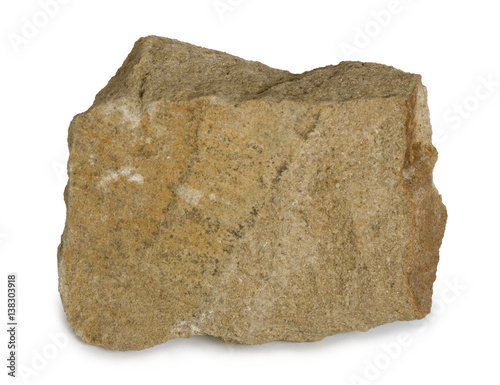 Sandstone mineral stone  is composed of quartz and/or feldspar. Sandstone (arenite) is a clastic sedimentary rock composed mainly of sand-sized minerals or rock grains. Isolated on white background. photo