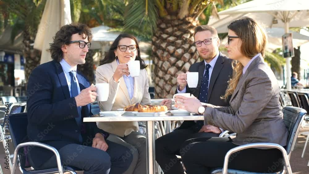Businesspeople drinking coffee in the cafe and smiling to the camera
Businesspeople drinking coffee in the cafe and smiling to the camera