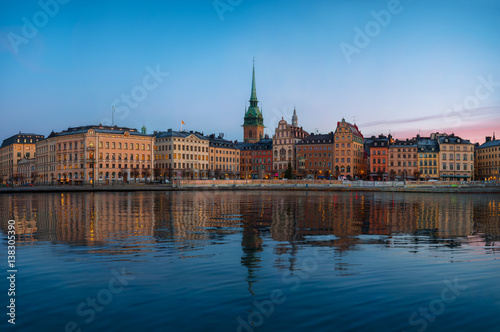Stockholm old town at morning, colorful sunrise and reflections in water, Gamla Stan, Stockholm, Sweden