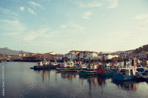 Acient fishing harbour. Saint-Jean-de-Luz  France  Europe. Panoramic view of old European city  image toned.