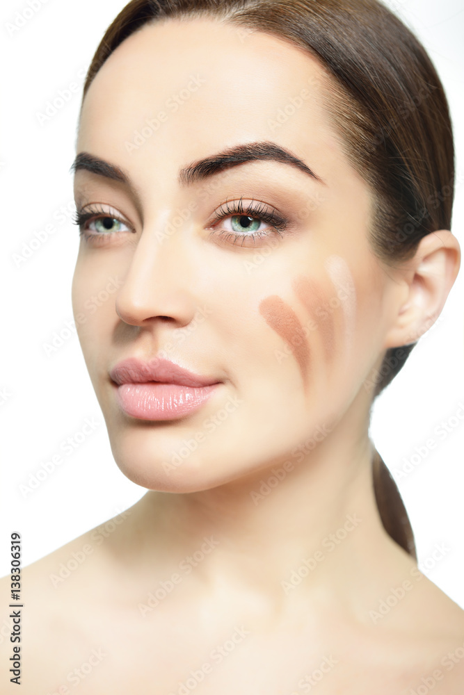 Young woman with beautiful creative makeup. Sexy girl's portrait. Concealer, skin tone.