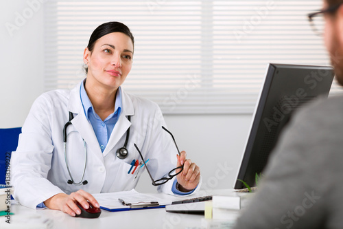 Young female doctor listening intently