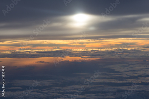 View of sunset and cloud from airplane