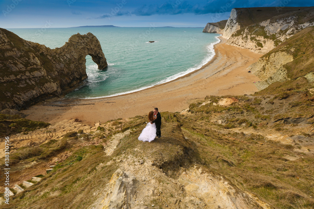 Groom and bride on the coast